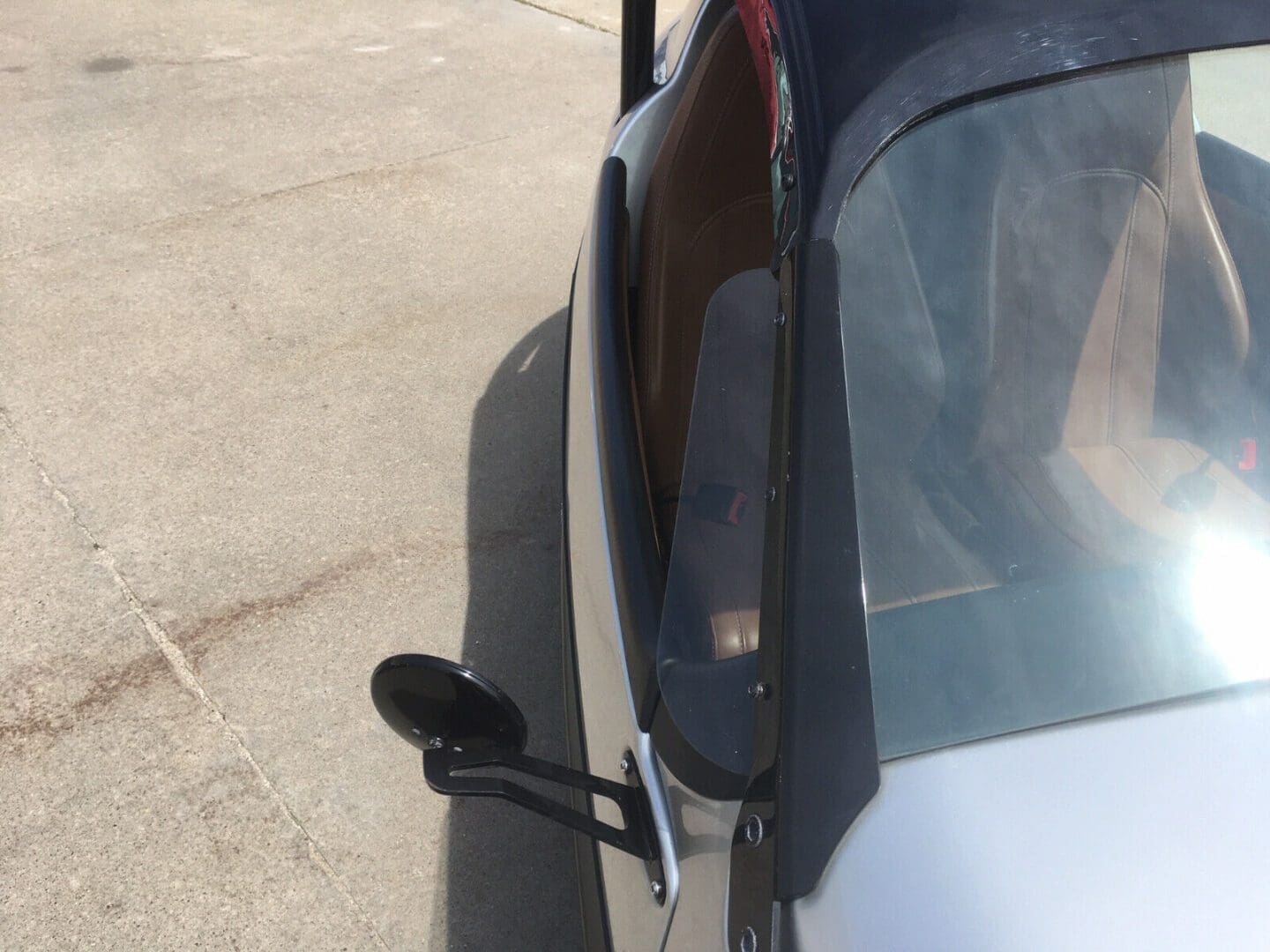 Close-up of a car's side mirror and part of the door.
