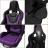A sleek black and purple gaming chair with ergonomic features.