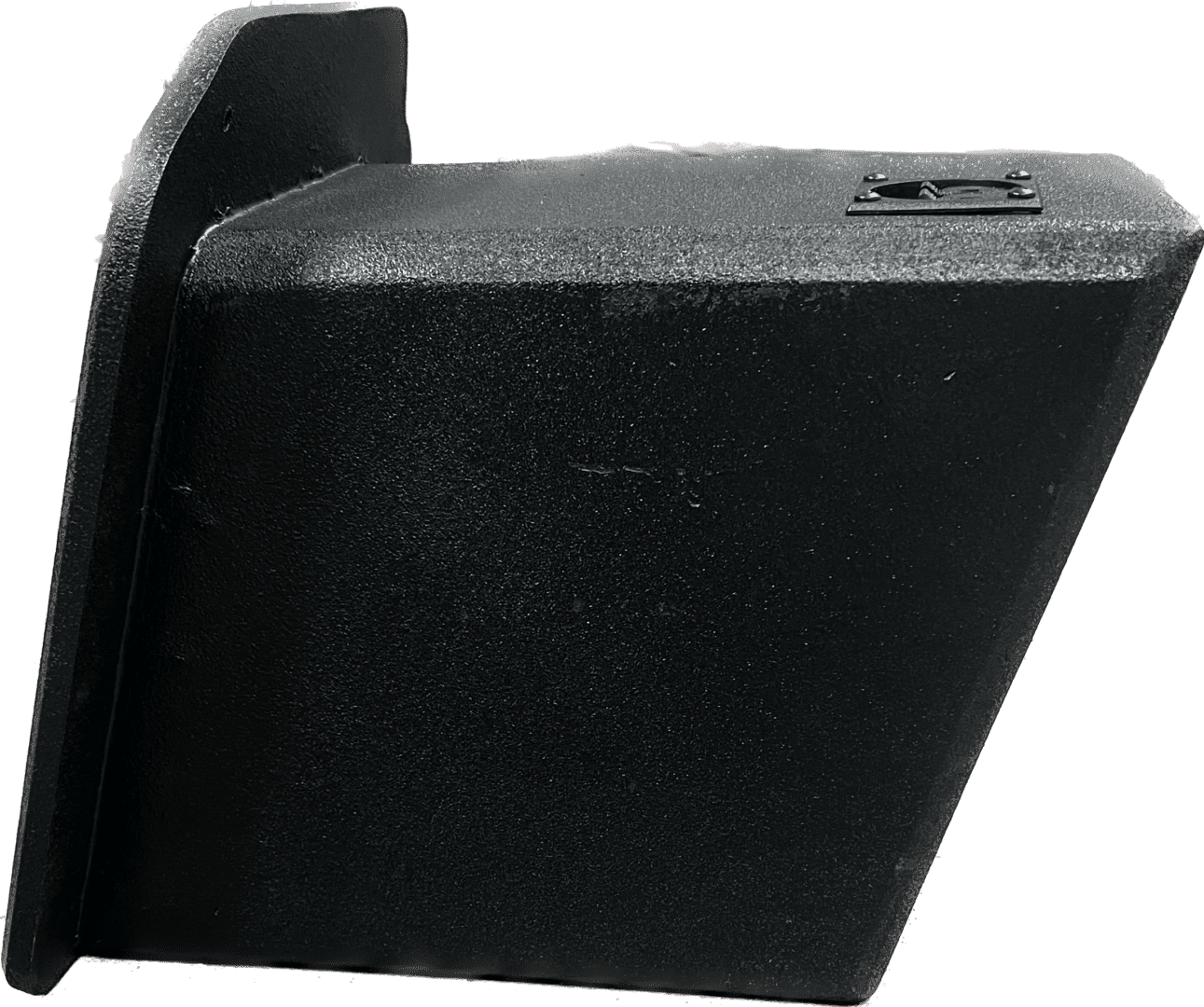 A black rectangular object with a textured surface and a protruding edge.