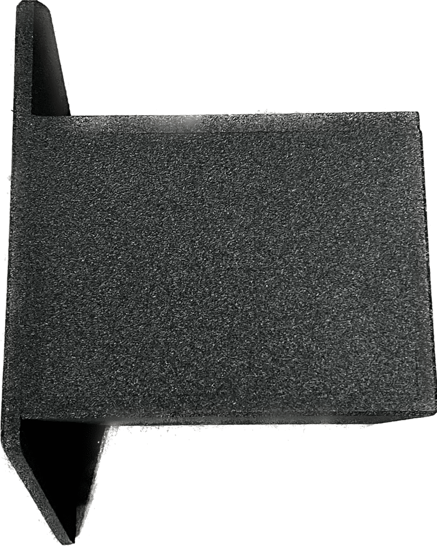 A rectangular piece of dark gray foam or sponge material.