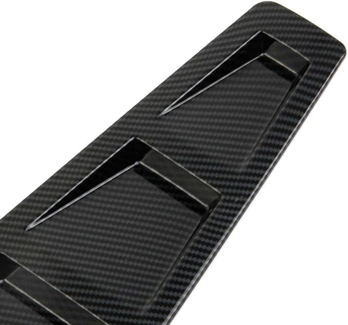 A sleek black carbon fiber fin for water sports.