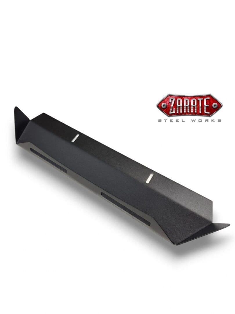 Black carbon fiber rear diffuser with angled fins for a car.