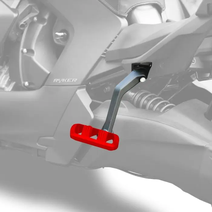 Close-up of a red gear shifter pedal inside a motorcycle.