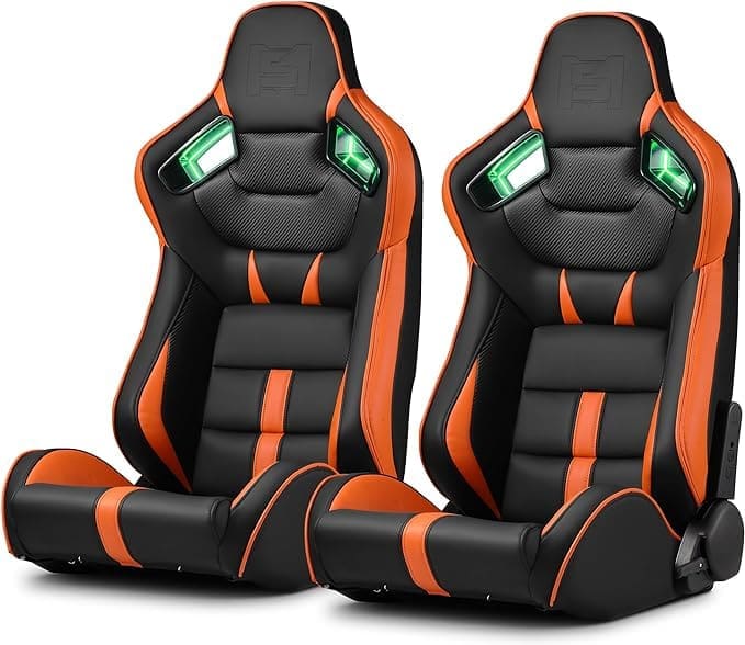 Two black and orange gaming or racing seats with headrests.