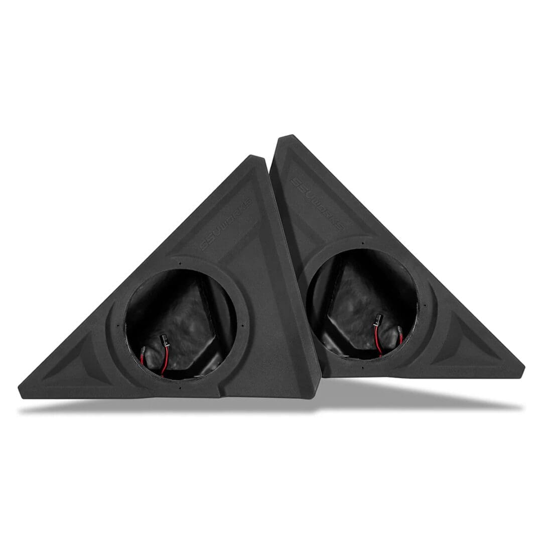Pair of black triangular car speaker enclosures with visible speakers.
