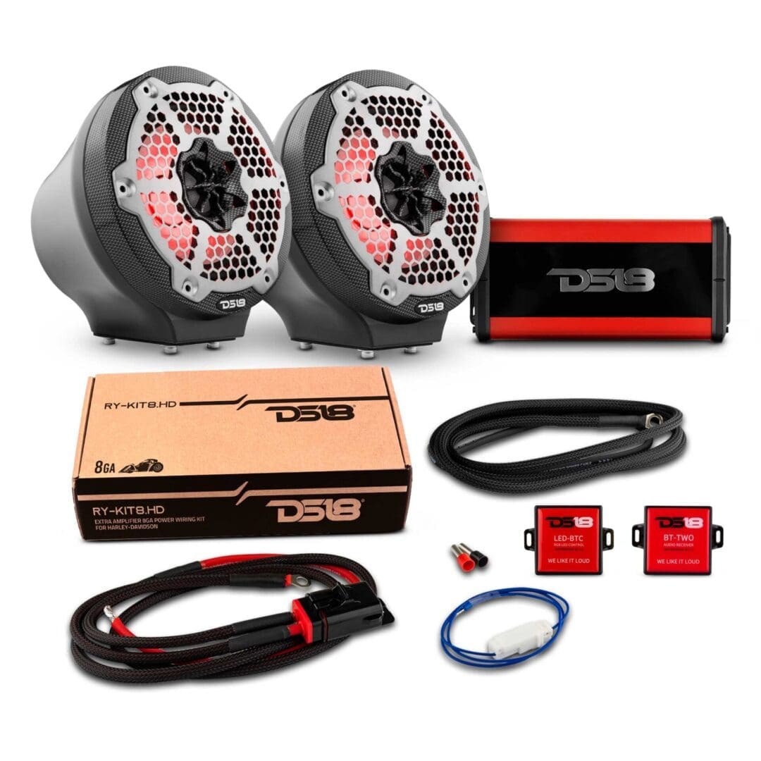 Two black and red car audio speakers with wiring and accessories.