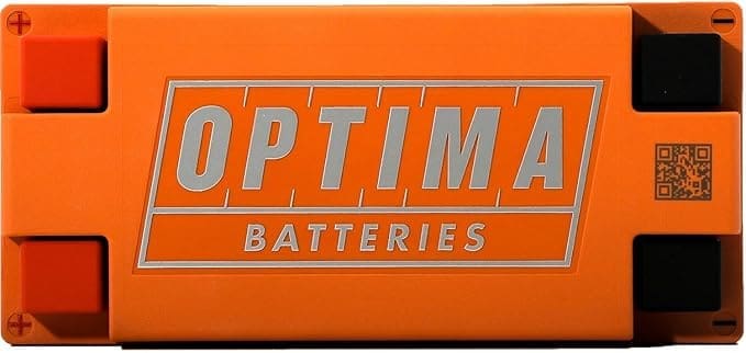 Close-up of an orange Optima battery casing with logo.