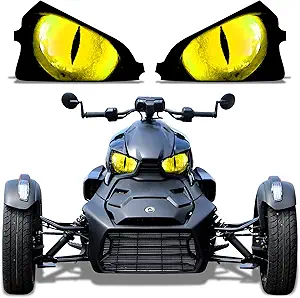 A sleek black and yellow sports car with glowing eyes above it.