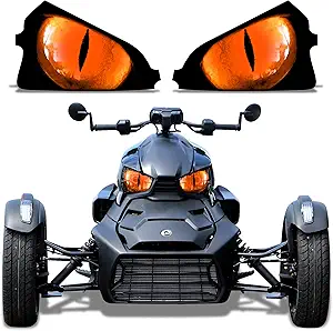 A sleek, futuristic black car with glowing orange eyes above it.