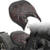 Custom motorcycle seat with black leather and red stitching.