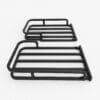 Two black metal luggage racks stacked on a white background.