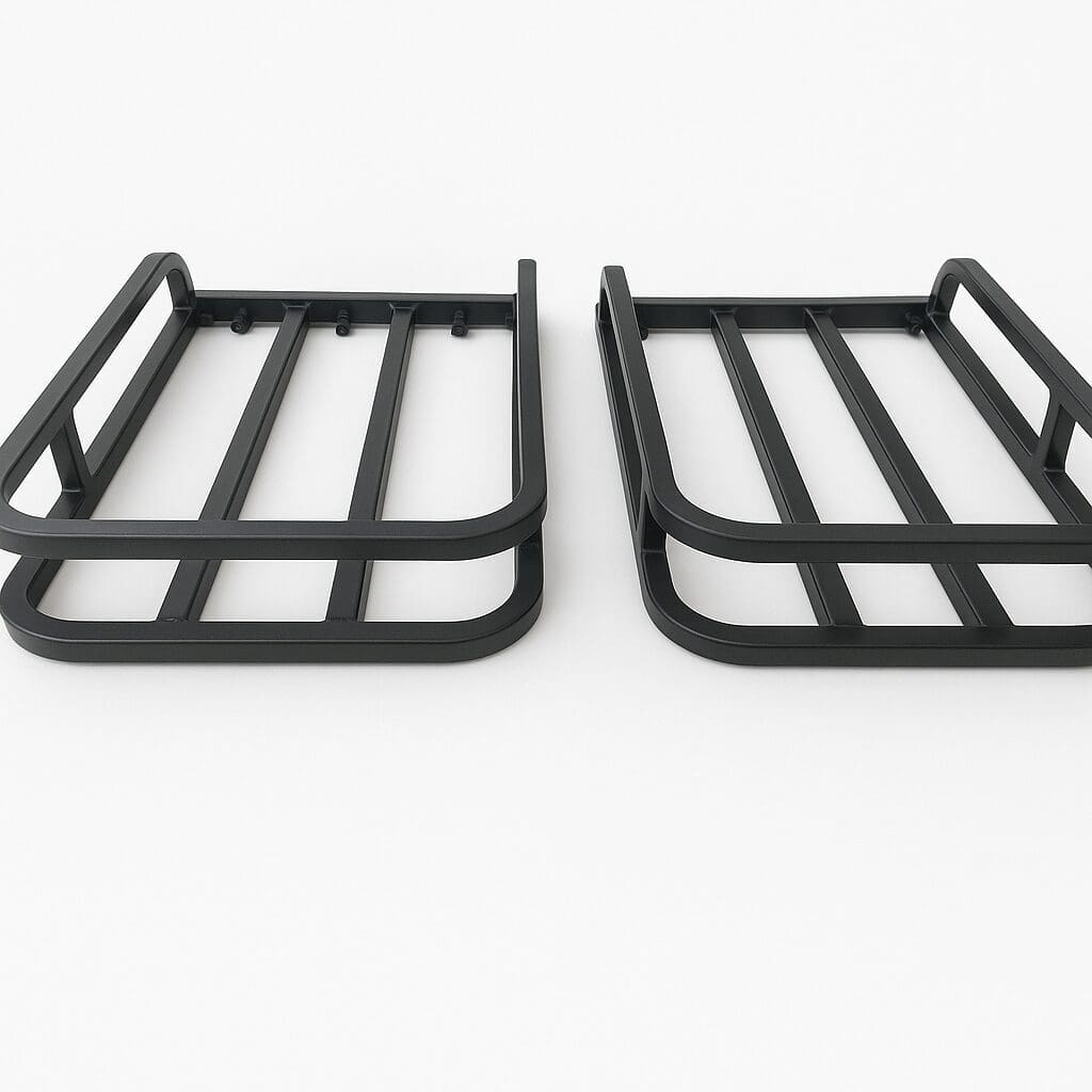 Two black metal racks placed side by side on a white surface.