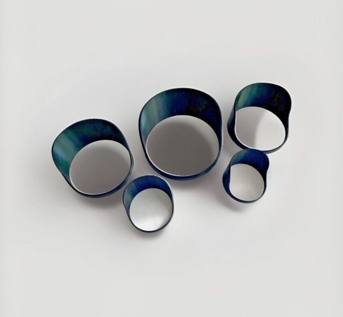 img_1062 Five assorted ceramic bowls with dark exteriors and light interiors.